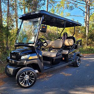 2022 REVO 4+2 lithium street-legal golf cart for sale in Santa Rosa Beach, FL — 48V LSV with LED lights and Bluetooth stereo.